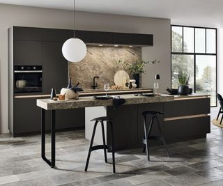 kitchen with island, dark coloured units, pendant light and task lighting above sink area on back wall