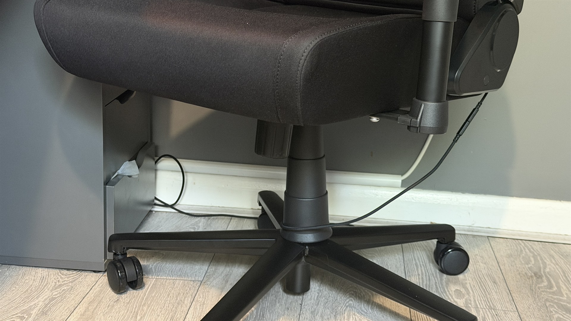The Razer Soma Chroma gaming chair set up in front of a desk.
