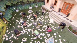 Big Brother Houseguests competing in a competition