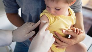 an infant receives a vaccine
