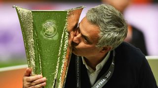 Jose Mourinho kissing the Europa League trophy