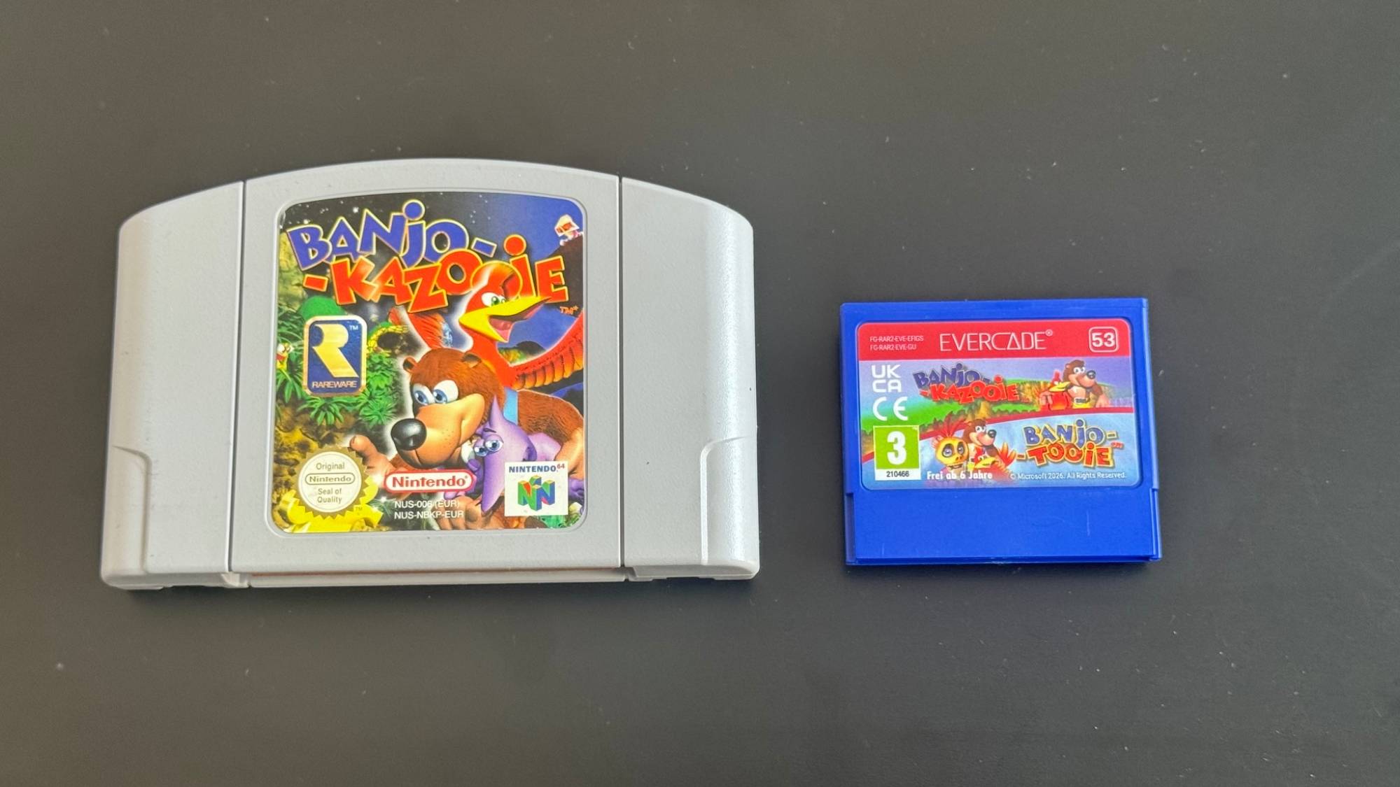 Banjo-Kazooie N64 cartridge next to an Evercade Banjo-Kazooie Double Pack cartridge