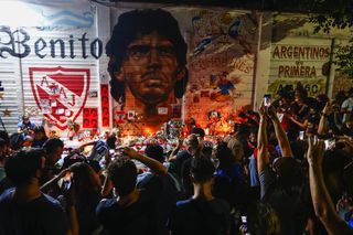 Fans hold a vigil for Diego Maradona outside the stadium of Argentinos Juniors