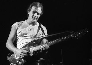 Dutch guitarist Jan Akkerman performs on stage, Patronaat, Haarlem, Netherlands, 17th November 1984. He plays a Roland G-707 guitar synthesiser controller