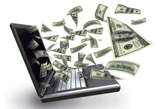Dollar bills flying out of a laptop screen