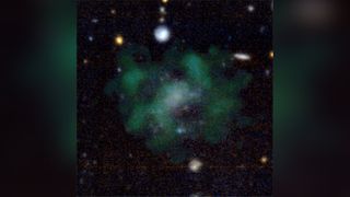 The galaxy AGC 114905 seems to be devoid of dark matter. In this image, the stellar emission is shown in blue; and green clouds show the neutral hydrogen gas.