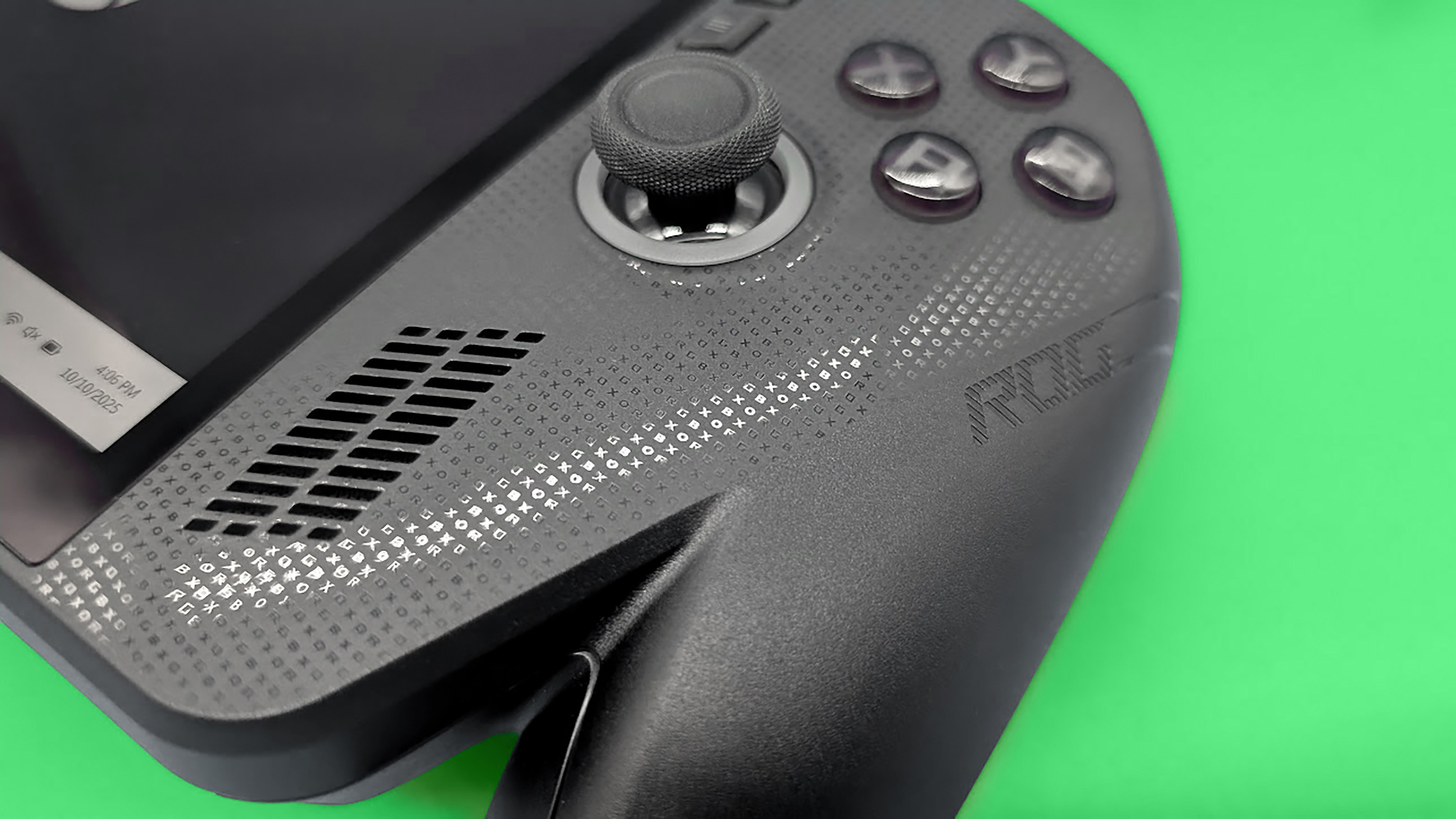 A closeup of the text on the face of the ROG Xbox Ally X .