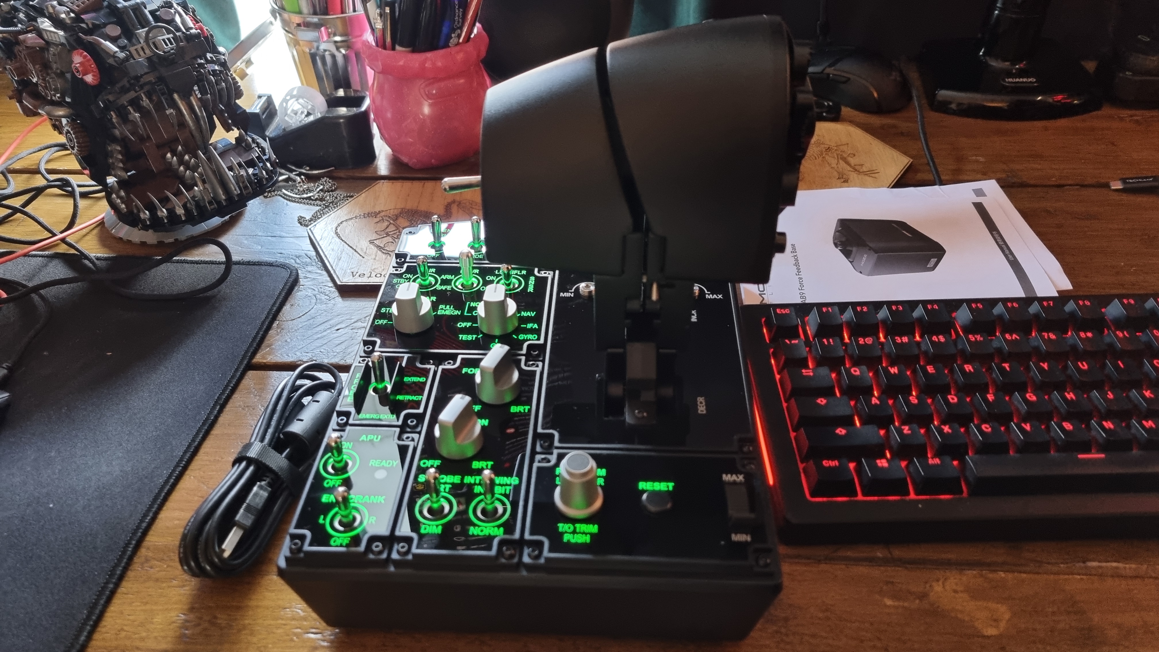 The various controls of the Moza MTP Throttle flight sim controller, lit up in green
