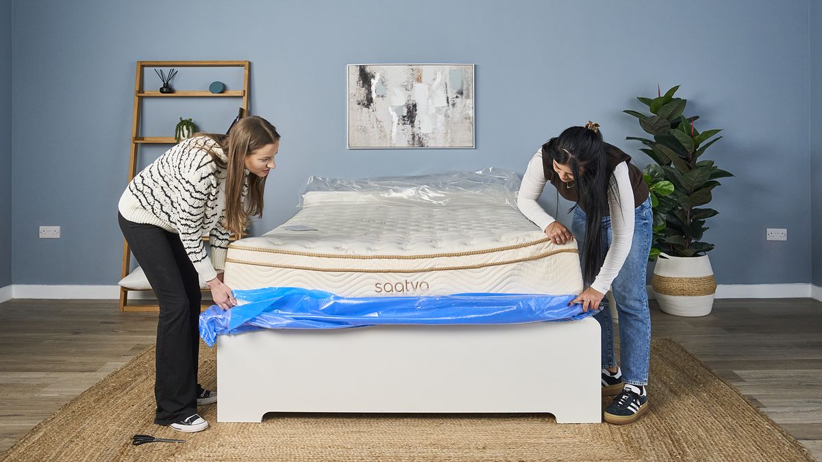 Our review team cut away the heavy protective blue and clear plastic wrapping covering the Saatva Classic mattress during shipping