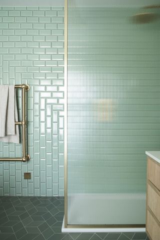 Mint green tiled shower