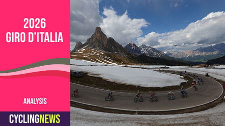 Wide shot of riders going over a mountain pass in the Dolomites, with a Cyclingnews Giro banner graphic on the right