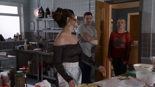 Daisy Midgeley making an apple pie in the Rivers Return kitchen as Ryan Connor and Bethany Platt walk through the door.