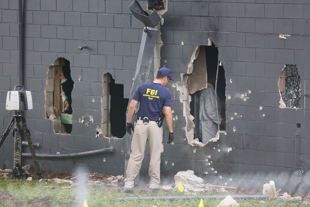 FBI officials investigate the Pulse nightclub following Sunday&amp;#039;s mass shooting