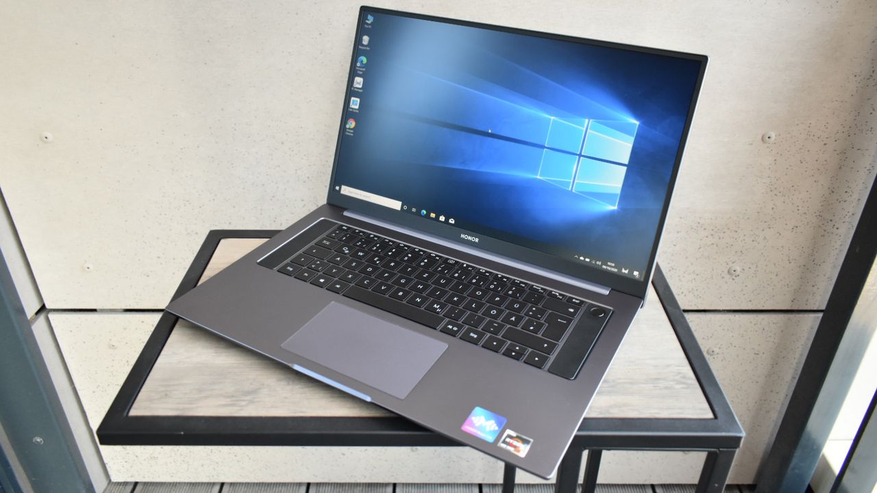 The Honor MagicBook Pro on a wooden desk