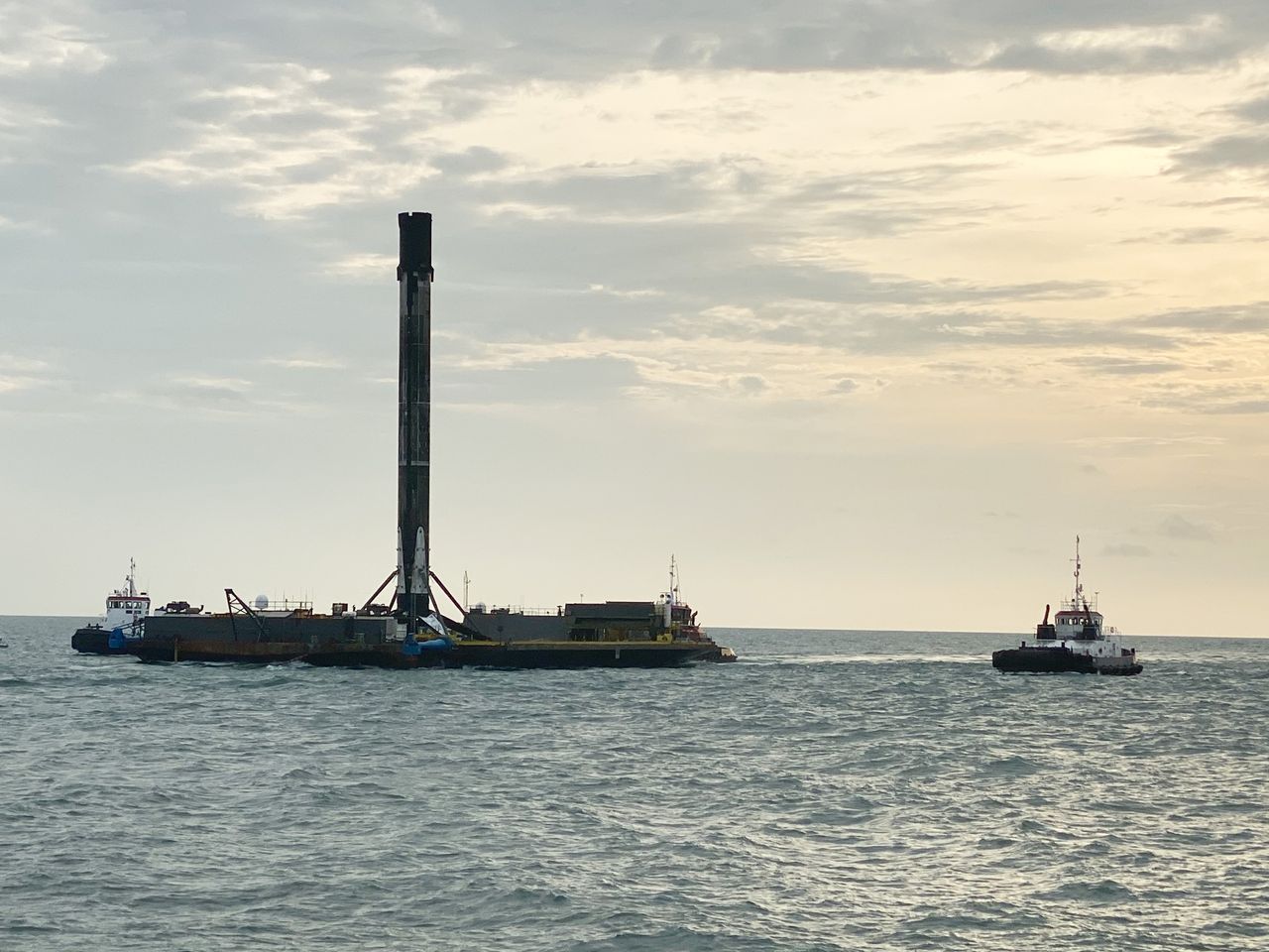 SpaceX's first Falcon 9 booster to fly six times returns home to Port Canaveral in Cape Canaveral, Florida on Aug. 21, 2020 atop the drone ship landing platform Of Course I Still Love You. The rocket launched 58 Starlink satellites and three Planet SkySats from Cape Canaveral Air Force Station on Aug. 18.