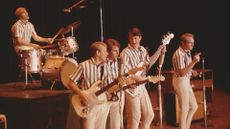A screenshot of The Beach Boys performing a song in their self-titled docufilm, which is one of May's new Disney Plus movies