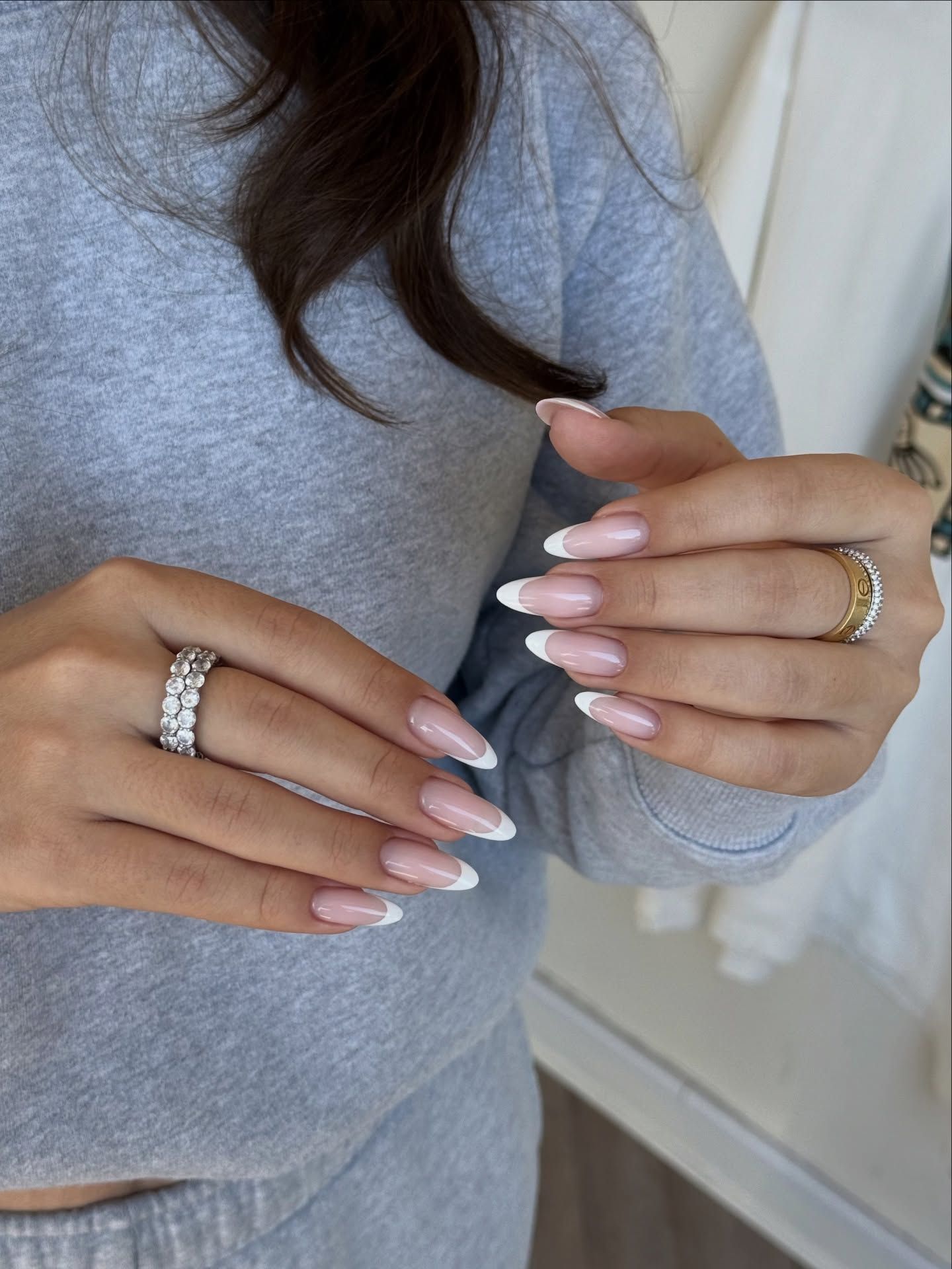Elongated French engagement nails.