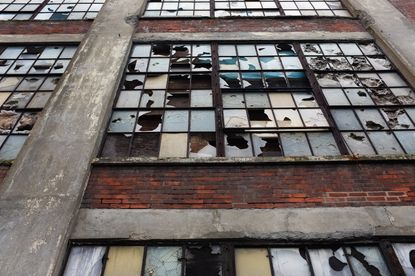 Broken windows in a factory.