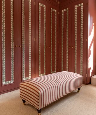 Dressing room with painted pink cabinets