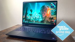 Alienware 16X Aurora on table with Cyberpunk 2077 on display with Tom's Guide Prime Day badge