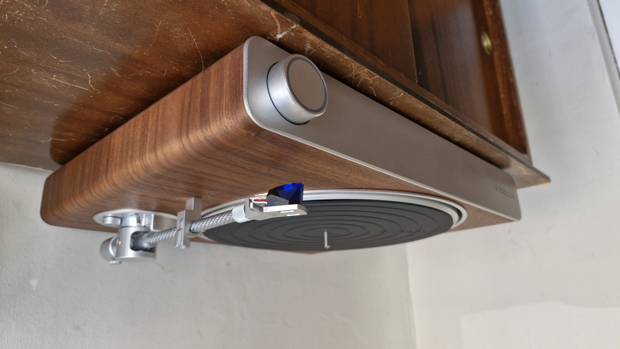 Victrola Stream Sapphire turntable on a wooden table