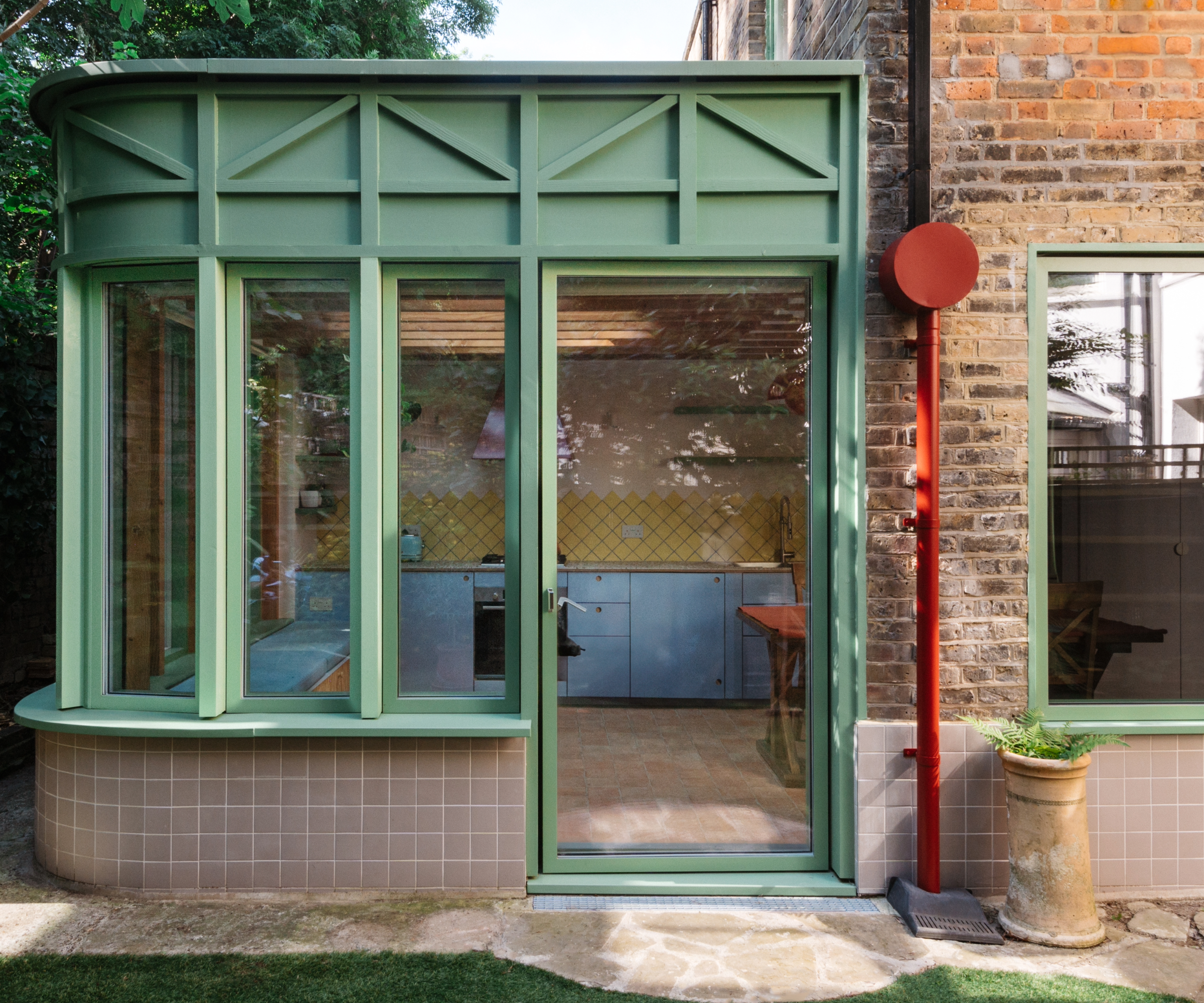 House exterior giving a view into the kitchen extension