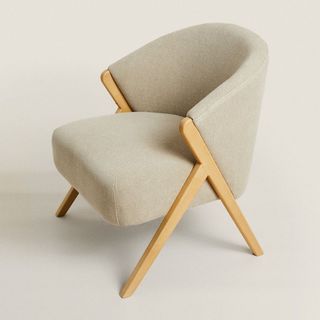 A linen upholstered armchair that's a part of Zara Home's summer sale.
