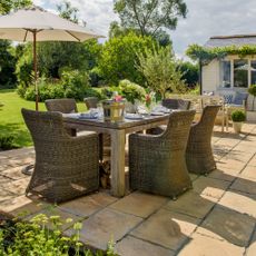 A patio with a garden furniture set