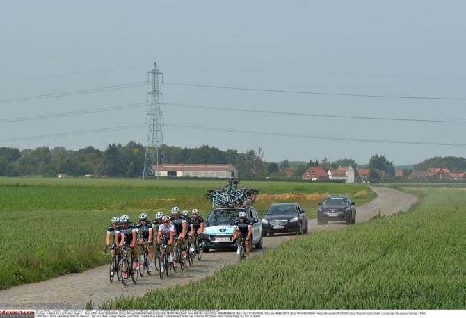 Omega Pharma QuickStep train over the cobbles that will be used during this year's Tour de France
