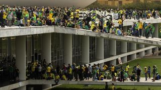 Why are right wing protestors wearing Brazil shirts?