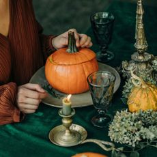 A woman eating one of the autumn foods that cause bloating