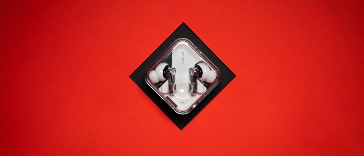 Nothing Ear (2) earbuds review on red background