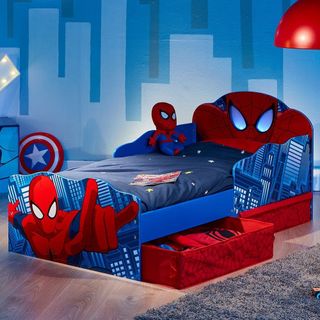 childrens room with spiderman bed and wooden flooring