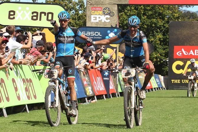 Roel Paulissen and Riccardo Chiarini of Torpado Factory celebrate as they cross the line to win the 5th stage