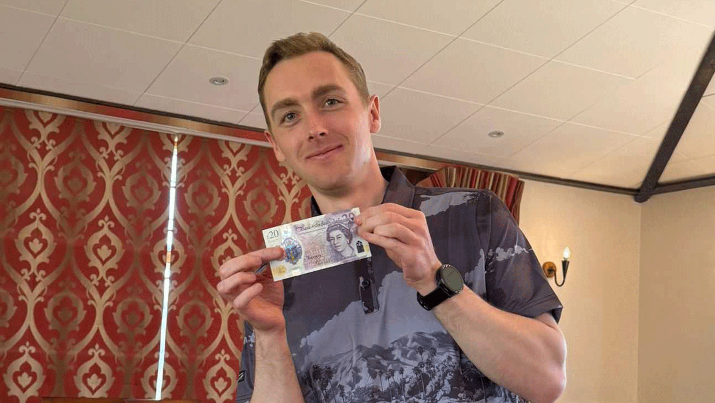 Jonny Leighfield poses with a &amp;pound;20 note after winning both the individual and team prizes at Golf Monthly's Spring/Summer Test Day 2026