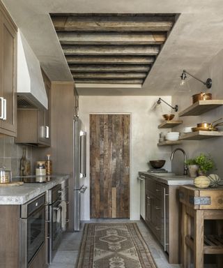 wood kitchen with runner and reclaimed wood door and butchers block