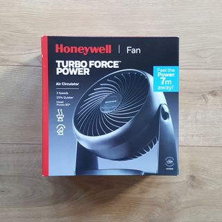 The black Honeywell Turbo Force Power fan on a wooden floor