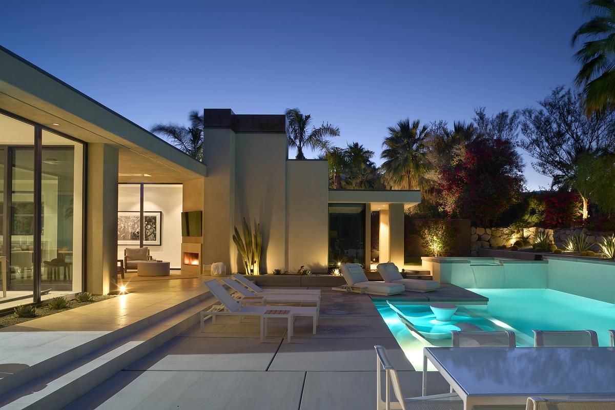 A backyard with uplighting