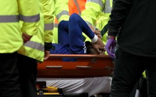 Andre Gomes is carried off the field on a stretcher with a serious-looking leg injury