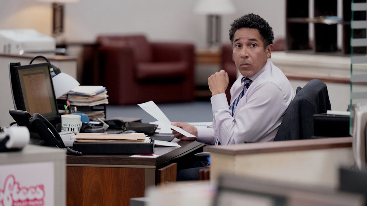 Oscar at his desk in The Paper