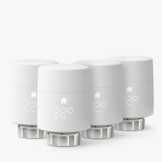 Four white radiator valves