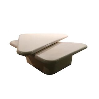 stone coffee table in triangular shape with rotating piece on top