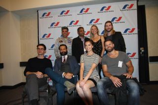 Front row: Steven Strait, Cas Anvar, Cara Gee, Wes Chatham; back row: NASA researcher Bobak Ferdowsi, "Expanse" showrunner Naren Shankar, "Expanse" writer Hallie Lambert and moderator Kyle Hill at a panel on the show May 25 in Los Angeles.