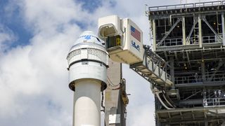 A United Launch Alliance (ULA) Atlas V rocket with Boeing's Starliner rolls from the Vertical Integration Facility (VIF) to the launch pad at Space Launch Complex-41 at Cape Canaveral Space Force Station.