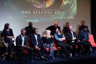 Astronauts and filmmakers participate in a Q&A with reporters before the world premiere of National Geographic's "One Strange Rock." (From left to right: NASA astronaut Nicole Stott, Canadian Space Agency astronaut Chris Hadfield, NASA astronaut Leland Melvin, showrunner Arif Nurmohamed, executive producer Jane Root, NASA astronaut Mike Massimino, executive producer Ari Handel, NASA astronaut Peggy Whitson, director Darren Aronofsky, NASA astronaut Mae Jemison and NASA astronaut Jerry Linenger)