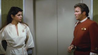 William Shatner looks taken aback by Kirstie Alley in a bathrobe in Star Trek II: The Wrath of Khan.