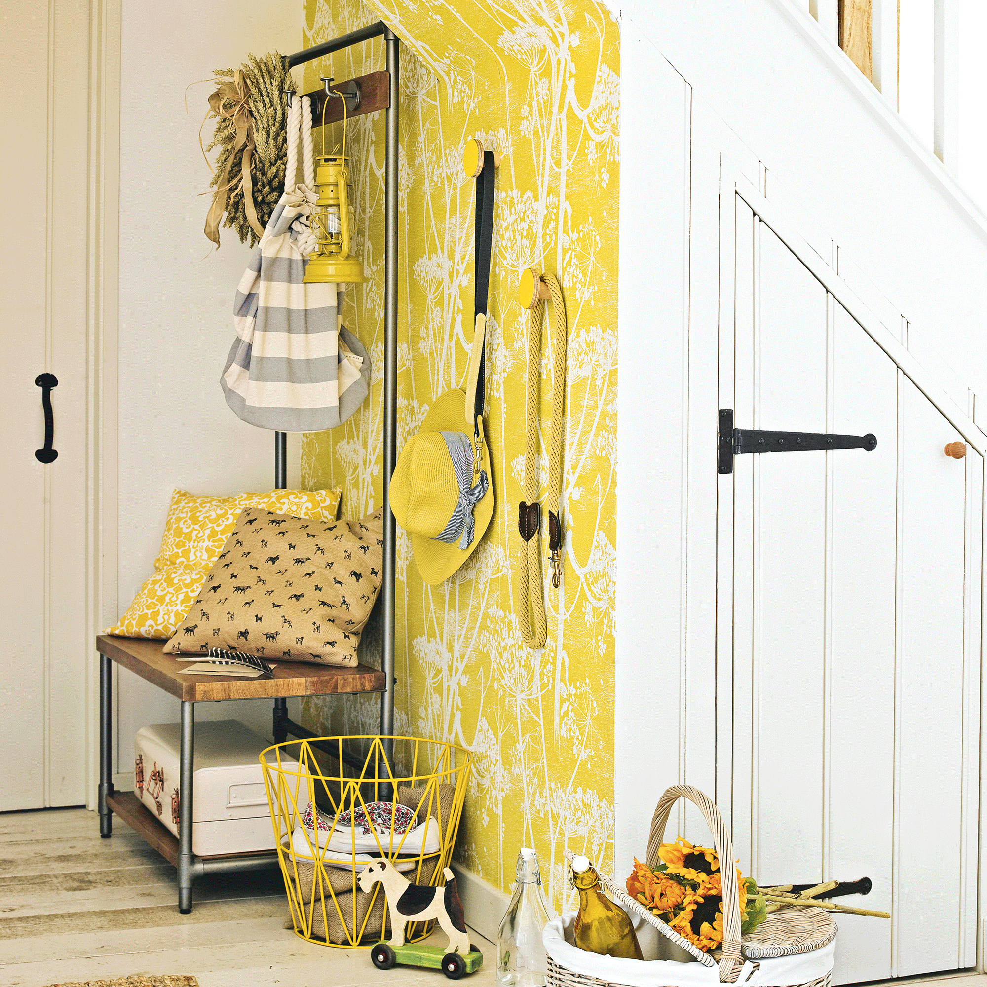 Yellow hallway with white cupboard