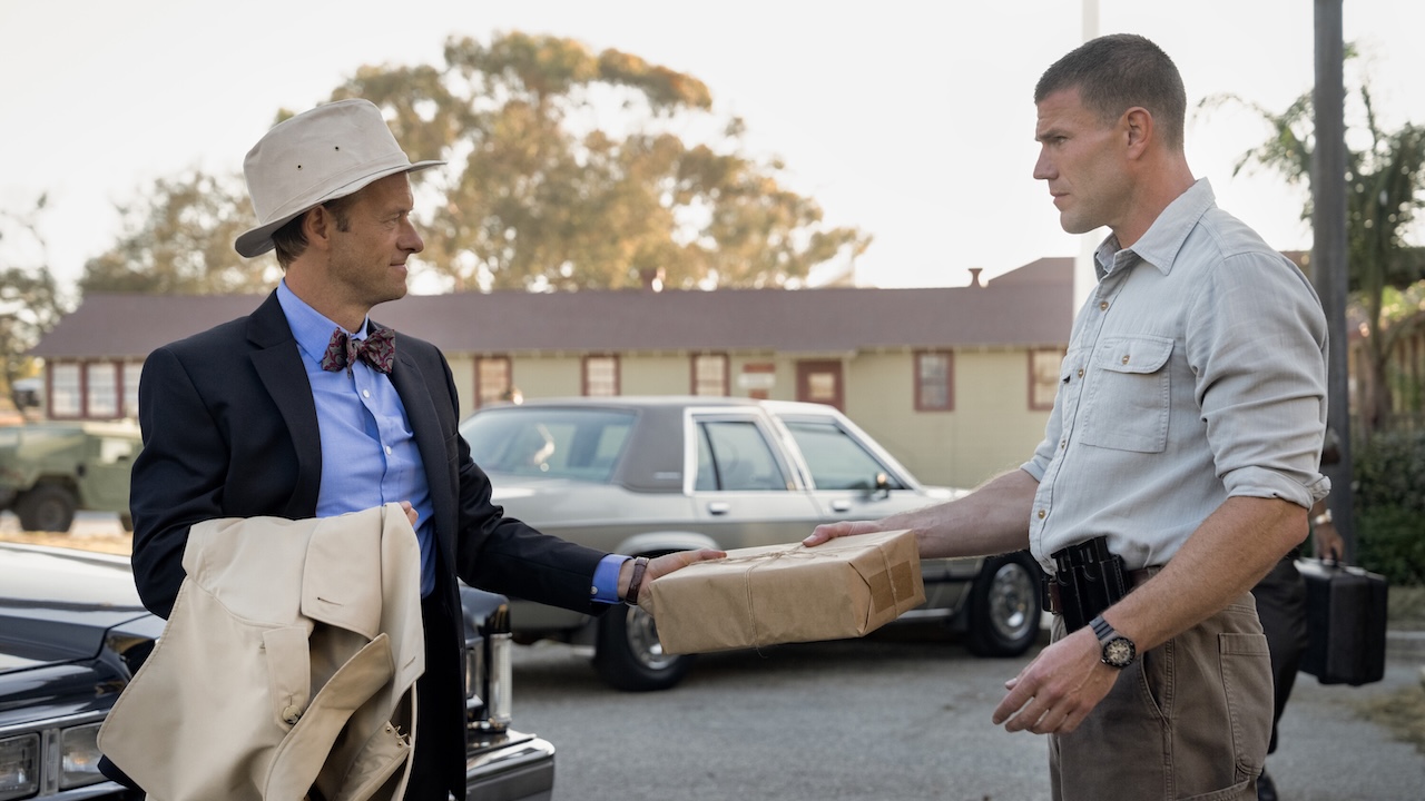 Ducky handing Gibbs a package outside NIS headquarters in NCIS: Origins