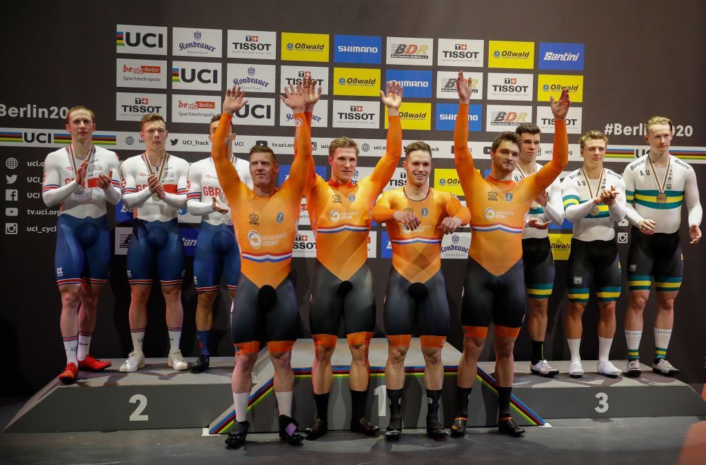 The Netherlands team C celebrates Gold on the podium with the British and the Australian team after the mens Team Sprint at the UCI track cycling World Championship in Berlin on February 26 2020 Photo by Odd ANDERSEN AFP Photo by ODD ANDERSENAFP via Getty Images