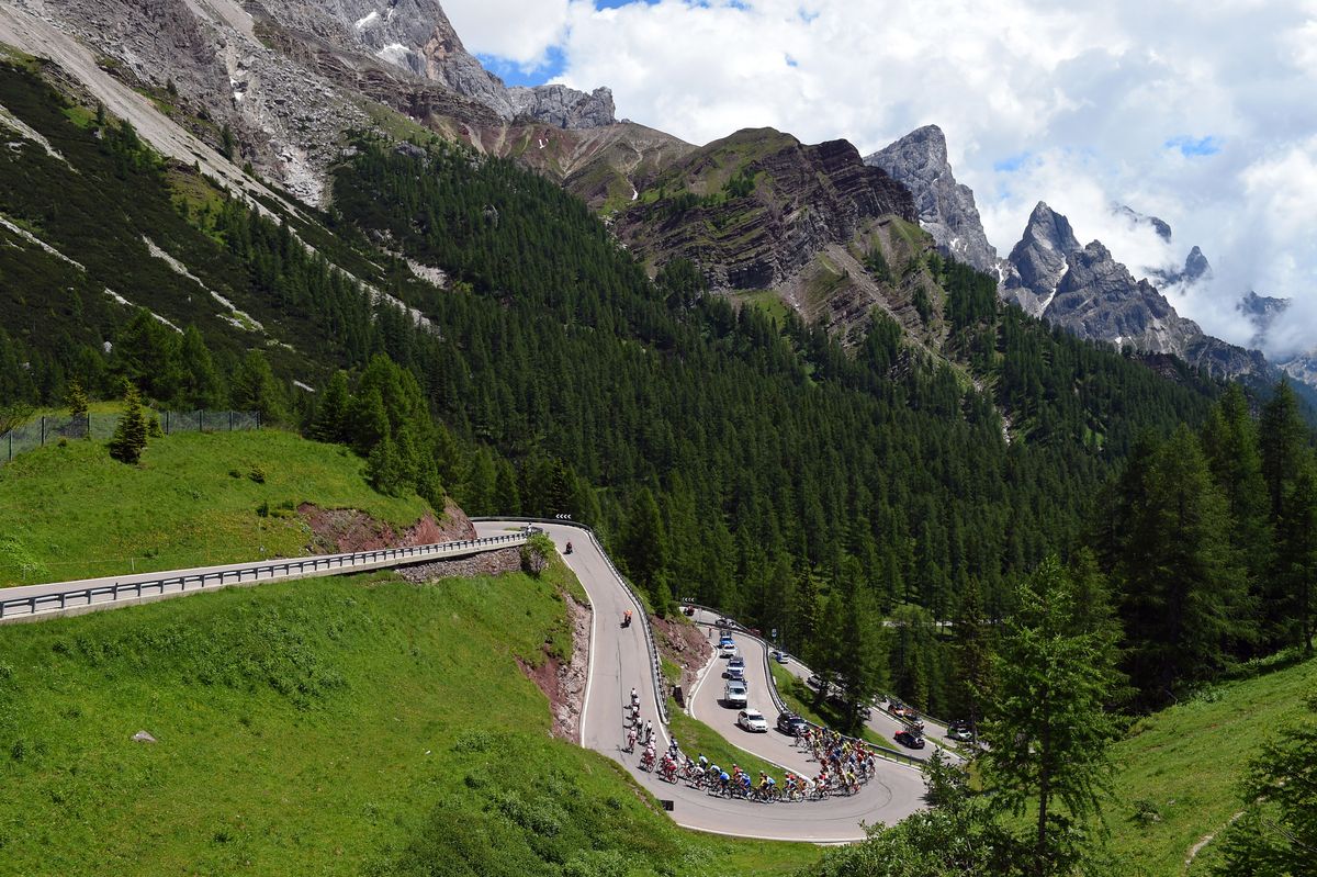 The peloton heads into the mountains